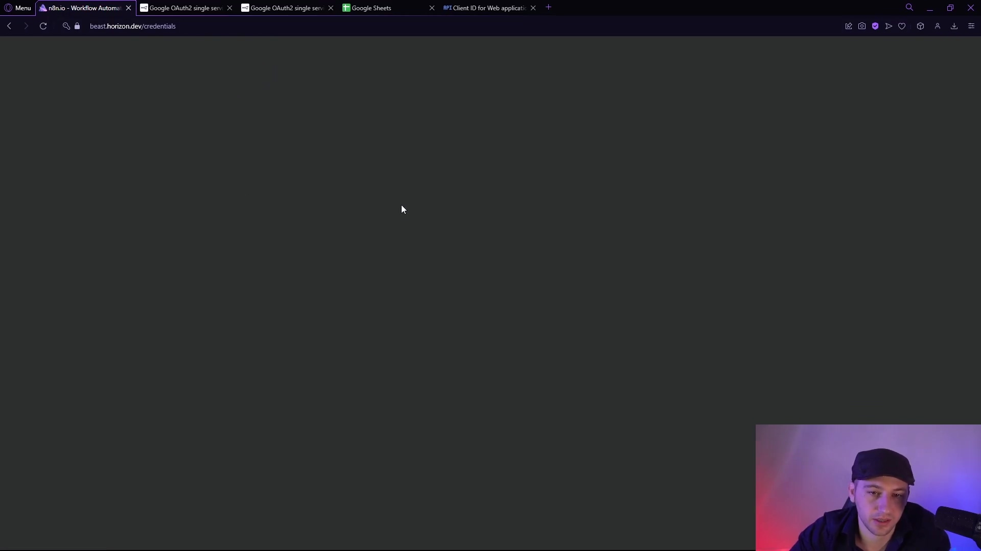 The image shows a dark gray web browser window, likely Google Chrome, with multiple tabs open at the top. The main content area is blank and dark gray, indicating a loading state or an empty page. A person's head and shoulders are visible in the bottom right corner, looking towards the screen. The browser tabs include 'n8n - Workflow Automatio...', 'Google OAuth2 single ser...', 'Google Sheets', and 'API Client ID for Web Applicati...'. The URL bar displays 'bean.horizondev.dev/credentials'.