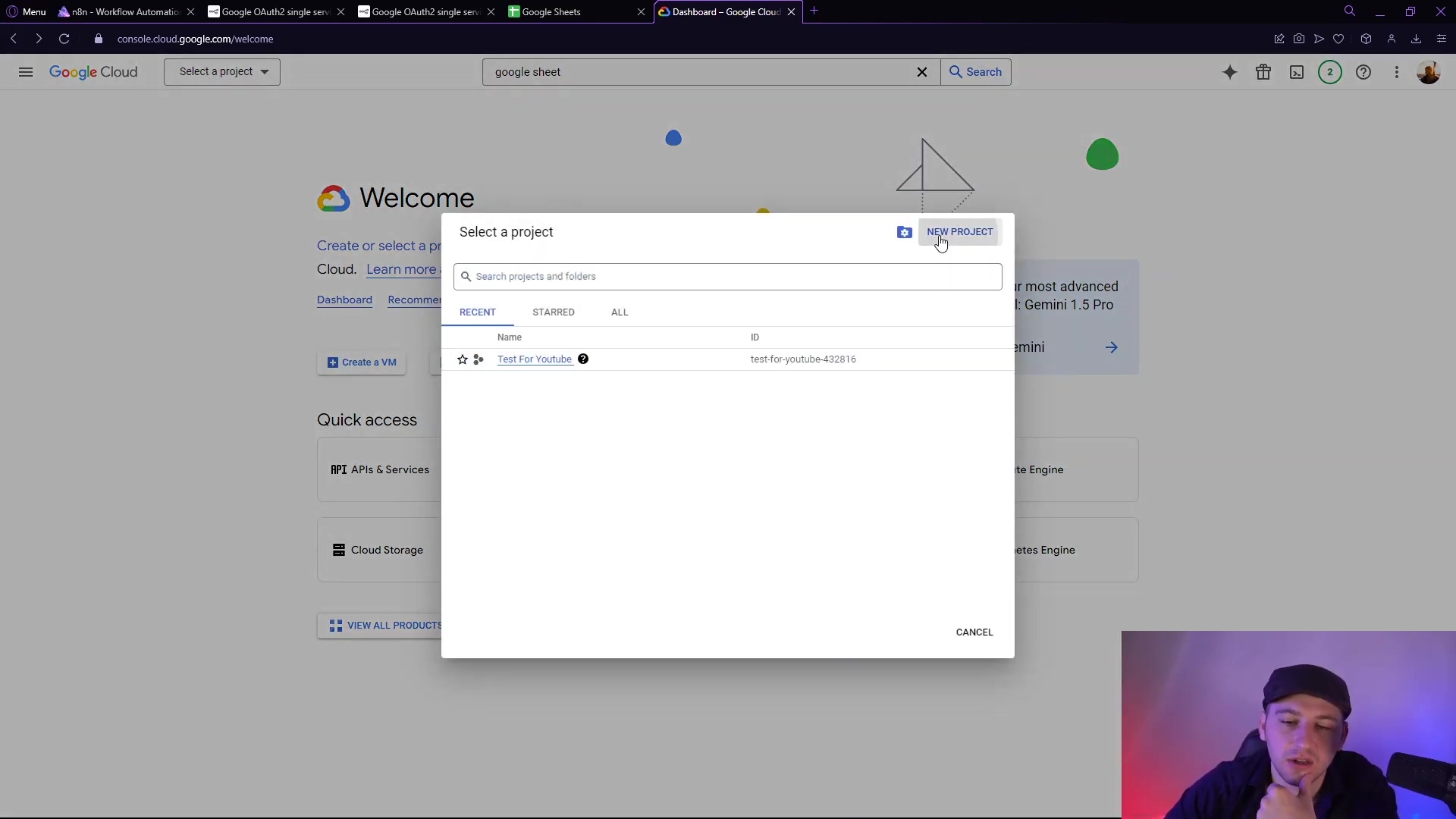 The image displays a Google Cloud console interface with a 'Select a project' pop-up window open in the center. The main interface shows 'Welcome to Google Cloud' and options like 'Create or select a project' and 'Quick access' to 'APIs & Services' and 'Cloud Storage'. The pop-up window has a 'NEW PROJECT' button and lists 'Test For Youtube' as a recent project with its ID 'test-for-youtube-420316'. The man from the previous image is visible in the bottom right corner, looking at the screen.