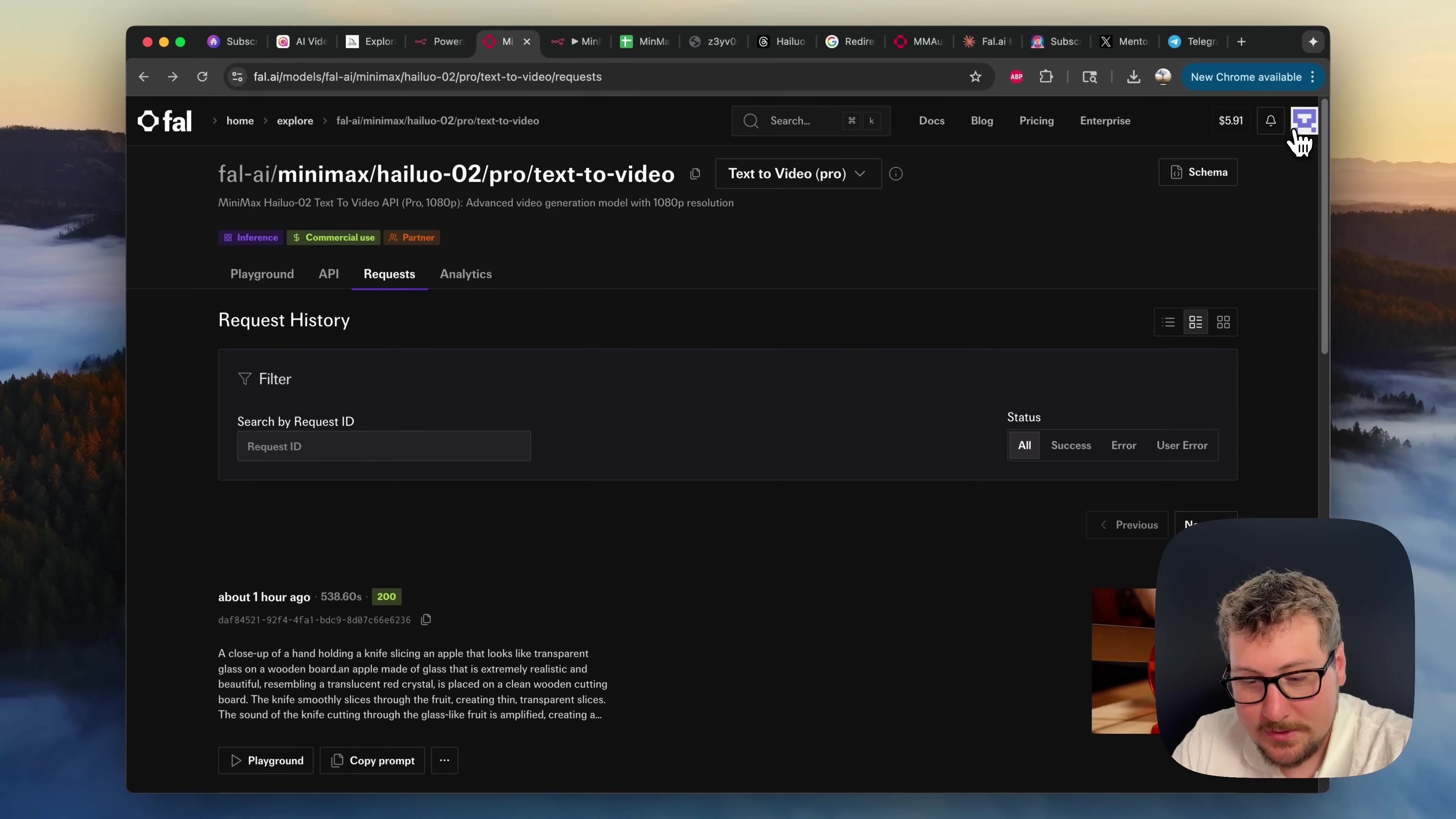 The image shows a dark-themed web interface for 'fal.ai/minimax/hailuo-02/pro/text-to-video' under the 'Requests' tab, with a man's face visible in the bottom right corner. The main section displays a 'Request History' with a 'Filter' option and a search bar for 'Request ID'. The 'Status' filter shows 'All', 'Success', 'Error', and 'User Error'. Below, a request entry is visible, showing 'about 1 hour ago', '338.60s', and '200' (HTTP status code). The request ID 'daff4021-9d74-4fa1-b0f1-b8f06ed6238' is also displayed. A detailed prompt description, similar to the one in the first image, is shown below the request ID, starting with 'A close-up of a hand holding a knife slicing an apple that looks like transparent glass on a wooden board. an apple made of glass that is extremely realistic and beautiful, resembling a translucent red crystal, is placed on a clean wooden cutting board. The knife smoothly slices through the fruit, creating thin, transparent slices. The sound of the knife cutting through the glass-like fruit is amplified, creating a...'. Below this, 'Playground' and 'Copy prompt' buttons are visible. On the right side, a video preview is partially visible. The browser tabs at the top are consistent with the previous images.