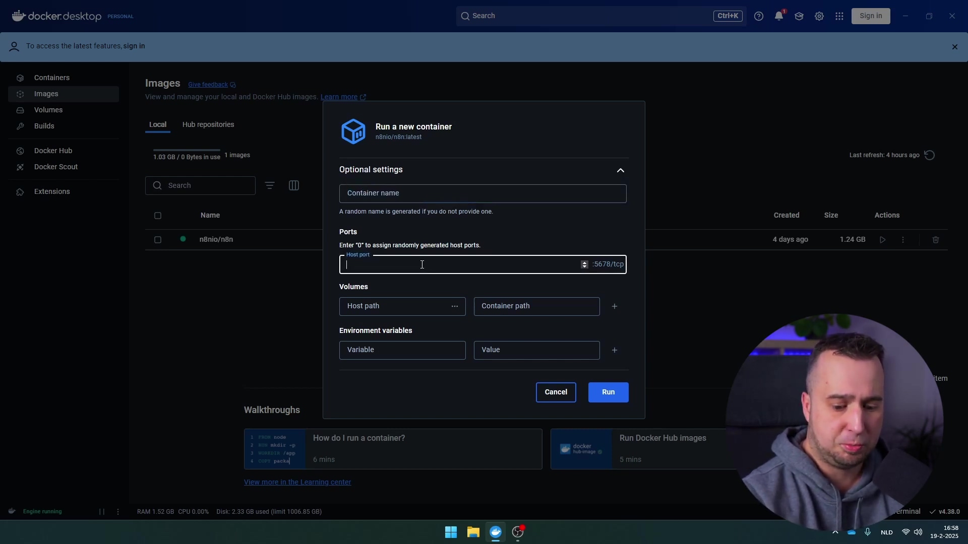 The image displays the Docker Desktop interface, specifically the 'Images' section, with a 'Run a new container' dialog box open. The dialog box shows 'n8nio/n8n:latest' as the image to run. Below this, there are 'Optional settings' including fields for 'Container name', 'Ports' (with 'Host port' and 'Container path' for '5678/tcp'), and 'Volumes' (with 'Host path' and 'Container path'). 'Environment variables' also has 'Variable' and 'Value' fields. At the bottom of the dialog, there are 'Cancel' and 'Run' buttons. The main Docker Desktop interface shows 'n8nio/n8n' listed as an image with a size of '1.24 GB'. A man is visible in the bottom right corner, looking at the screen and gesturing with his right hand. The bottom bar shows 'Engine: running', 'RAM 1.52 GB CPU 0.00%', and 'Disk: 2.20 GB used (limit 1006.85 GB)'.