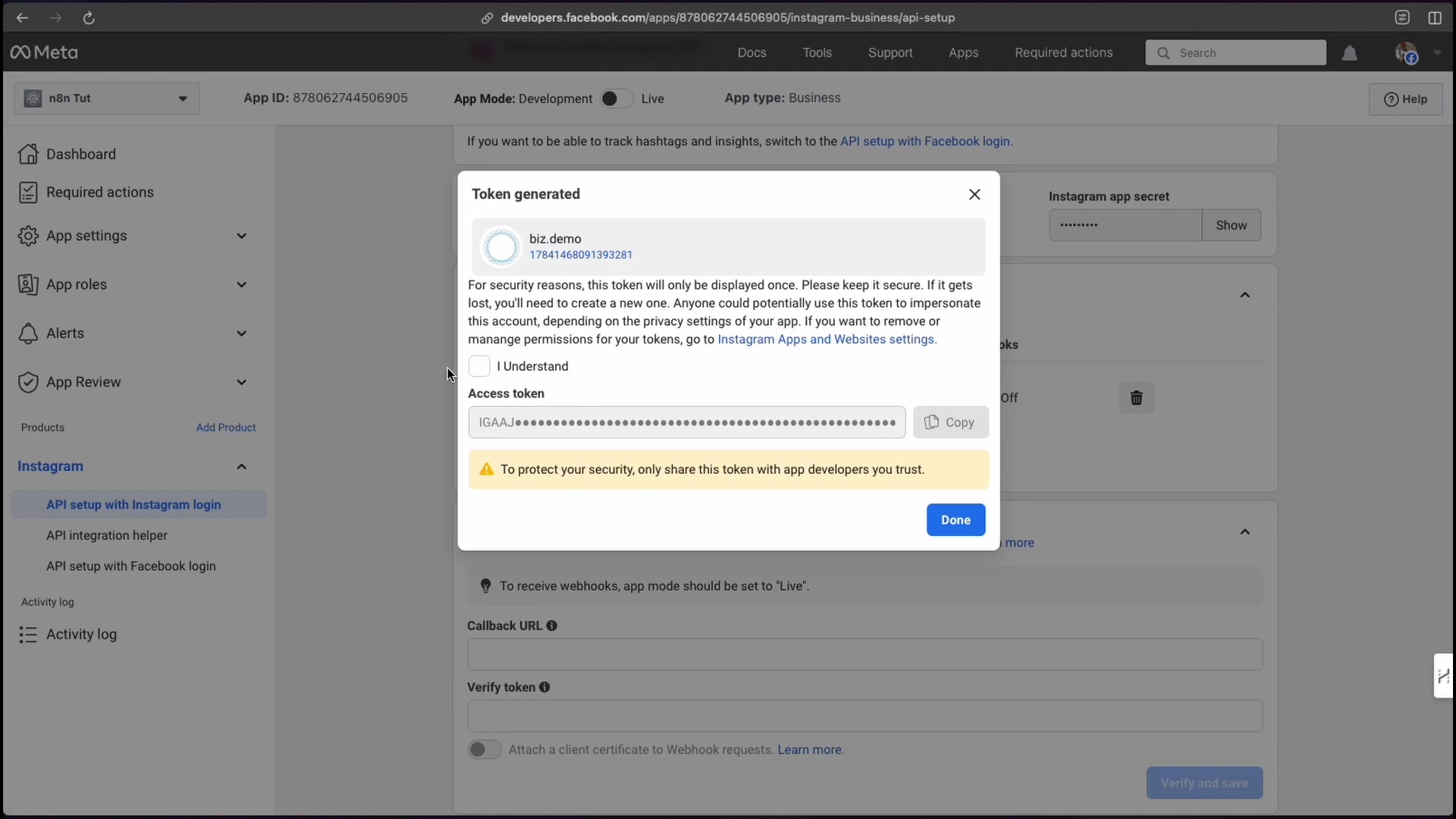 The image shows a pop-up window titled 'Token generated' overlaid on the Meta for Developers dashboard. The pop-up displays the Instagram account 'biz.demo' with its ID '1784146891393281'. Below this, there's a warning message about the token only being displayed once and instructions to keep it secure. An 'Access token' field is present, partially obscured by asterisks, with a 'Copy' button next to it. A yellow warning banner states, 'To protect your security, only share this token with app developers you trust.' At the bottom right of the pop-up, there's a 'Done' button. The background shows the 'Instagram API setup' page with sections for 'Generate access tokens' and 'Configure webhooks'.