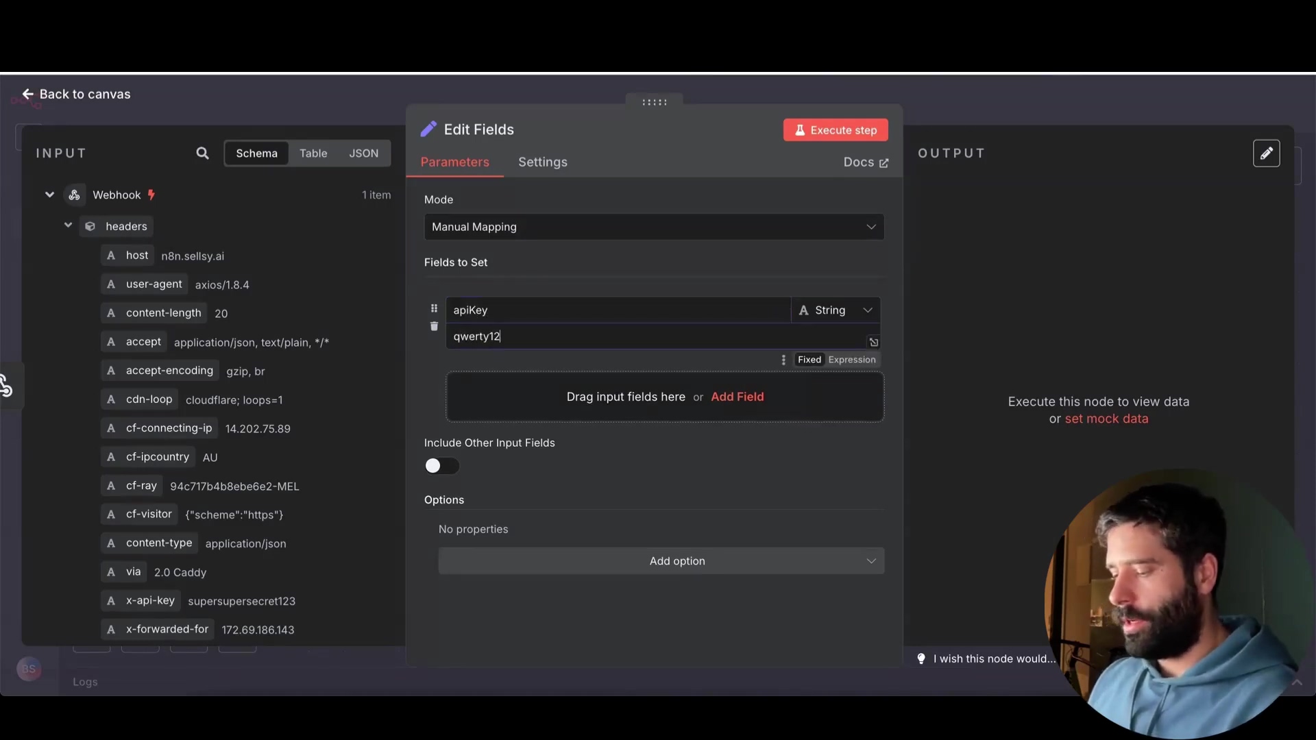 The image displays a dark-themed software interface, likely for workflow automation, with a focus on an 'Edit Fields' dialog box. On the left, an 'INPUT' panel shows 'Webhook' details including 'headers' with various fields like 'host', 'user-agent', 'content-length', 'accept', 'accept-encoding', 'cdn-loop', 'cf-connecting-ip', 'cf-ipcountry', 'cf-ray', 'cf-visitor', 'content-type', 'via', 'x-api-key', and 'x-forwarded-for', each with a value. The central 'Edit Fields' dialog has tabs for 'Parameters', 'Settings', and 'Docs'. The 'Parameters' tab is active, showing 'Mode: Manual Mapping' and 'Fields to Set'. Under 'Fields to Set', there's an 'apiKey' field with 'String' type and a value of 'qwertyf2'. Below this, there are options to 'Drag input fields here' or 'Add Field', and an 'Options' section with 'No properties' and an 'Add option' button. On the right, an 'OUTPUT' panel is visible with text "Execute this node to view data or set mock data". A man with a beard is visible in the bottom right corner, looking towards the screen.