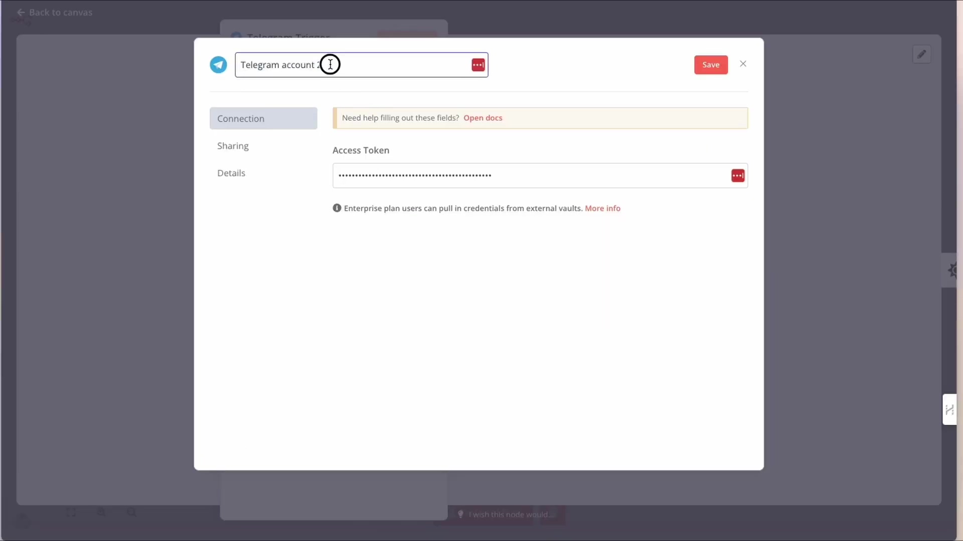 The image displays a modal window within the n8n interface, titled 'Telegram account: 1'. It's a form for configuring Telegram credentials. The window has three tabs: 'Connection', 'Sharing', and 'Details'. The 'Connection' tab is active, showing a warning message "Need help filling out these fields? Open docs". Below this, there's an 'Access Token' input field with its value masked by asterisks, and a small info icon next to it. A 'Save' button is visible in the top right corner. The background shows a blurred n8n canvas.