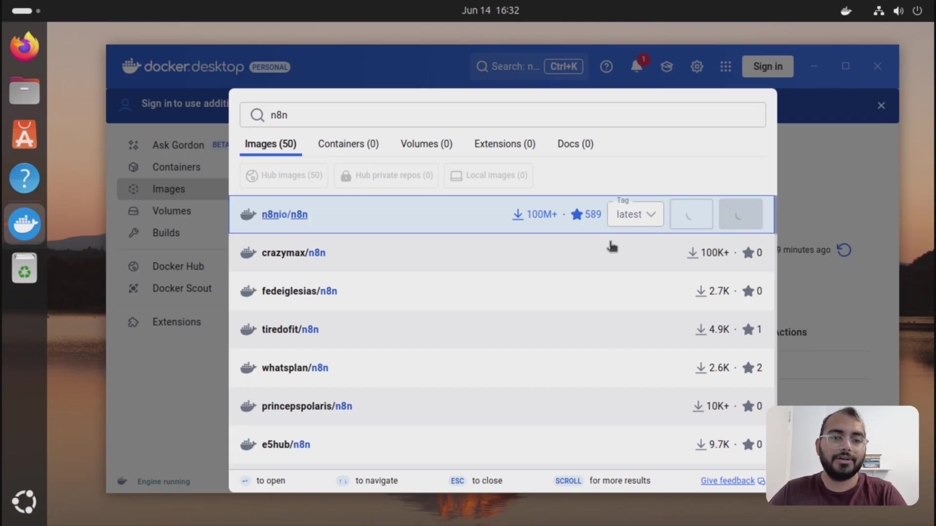 The image displays the Docker Desktop application interface, specifically showing the 'Images' section. A search bar at the top is populated with 'n8n', and the search results list various n8n-related images. The first result, 'n8n.io/n8n', is highlighted, indicating it's selected, with details like '100M+' pulls and '589' stars, and a 'latest' tag. Below this, other n8n images are listed with their respective pull counts and stars. The overall interface is dark-themed with a sidebar on the left showing navigation options like 'Containers', 'Volumes', and 'Images'. A person is visible in the bottom right corner of the screen, looking at the camera.