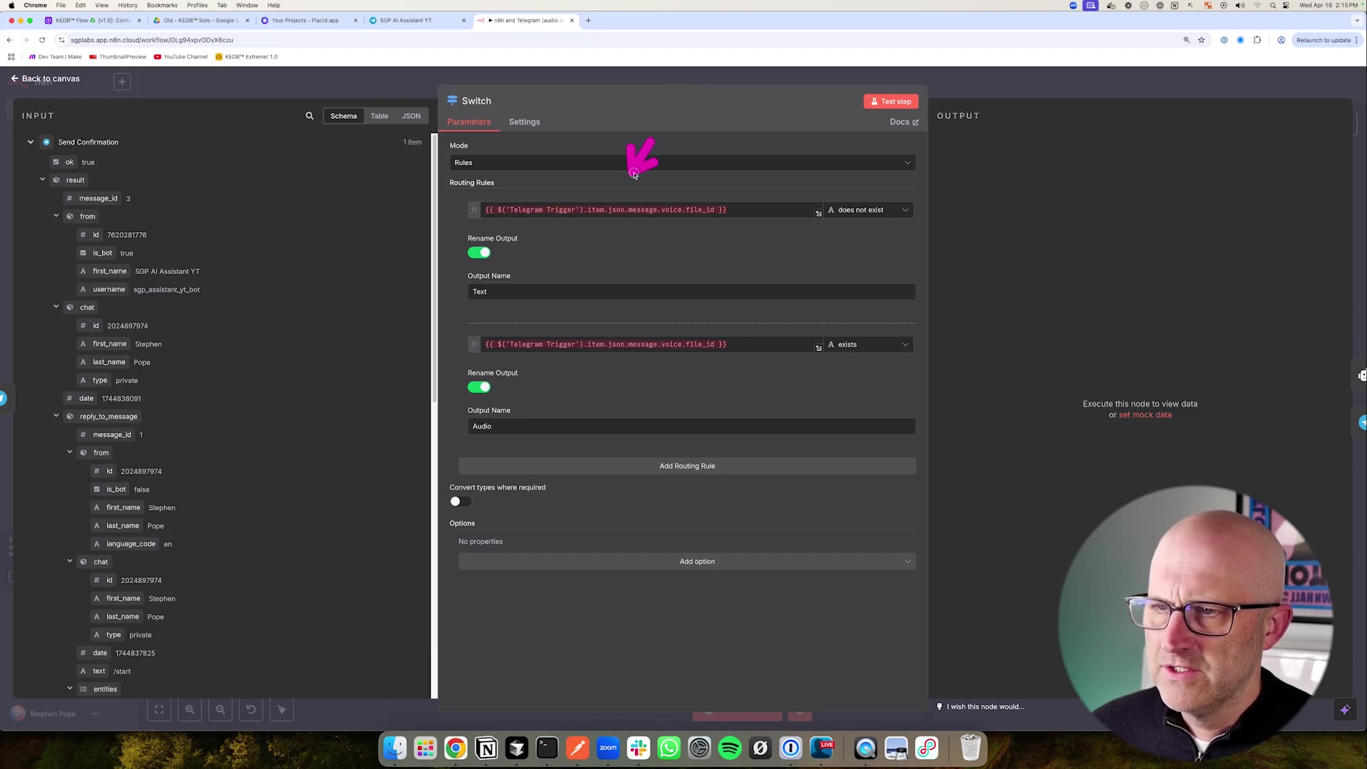 The image displays a software interface, likely a node-based workflow editor, with a prominent 'Switch' node configuration panel open. The panel shows 'Parameters' and 'Settings' tabs, with 'Parameters' currently selected. Within the parameters, there are sections for 'Mode' and 'Routing Rules'. Two routing rules are visible: one checks if 'Telegram Trigger' item 'json.message.voice.file_id' does not exist, leading to 'Text' output, and another checks if it exists, leading to 'Audio' output. A purple arrow cursor points to the 'Mode' dropdown. On the left, an 'INPUT' panel shows a JSON-like structure with details about a Telegram message, including 'message_id', 'from' user details (ID, first name, last name, username), and 'chat' details. A male presenter with glasses and a shaved head is visible in the bottom right corner, looking towards the screen. The top of the screen shows browser tabs and system information.