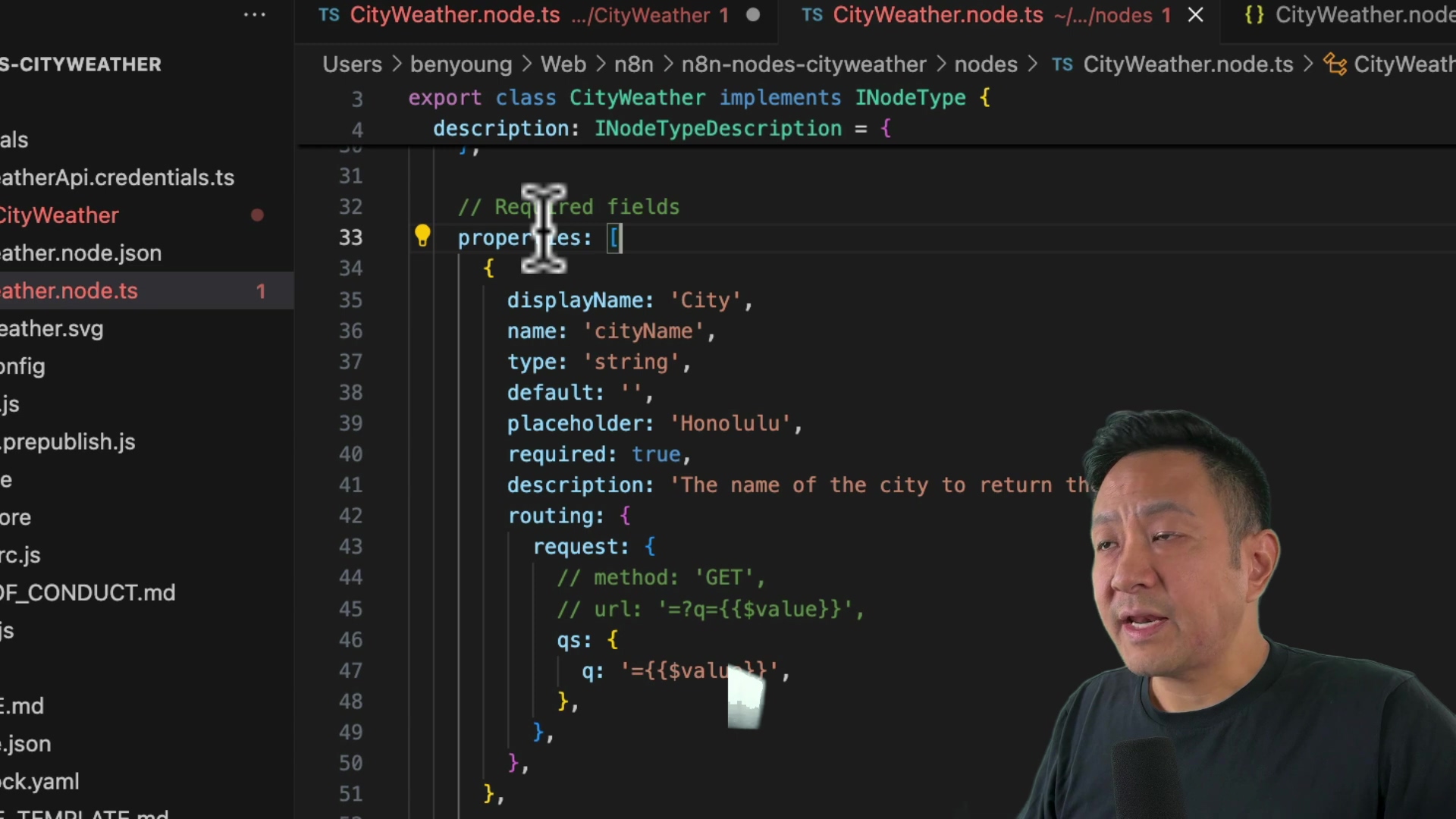 The image shows a screen capture of code in an IDE, likely VS Code, with a man's face visible in the lower right corner. The code appears to be related to creating a custom node for n8n, with file names like 'CityWeather.node.ts' and 'CityWeather.node.json' visible in the file explorer on the left. The code itself includes JavaScript syntax with properties like 'displayName', 'name', 'type', 'default', 'placeholder', 'required', and 'description'. The man is looking towards the code and appears to be explaining it.