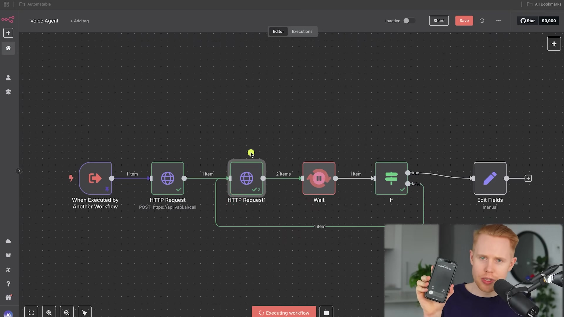 The image displays an n8n workflow interface with several interconnected nodes. The workflow is titled 'Voice Agent'. Nodes include 'When Executed by Another Workflow', two 'HTTP Request' nodes, a 'Wait' node, an 'If' node, and an 'Edit Fields' node. A green checkmark is visible on the first 'HTTP Request' node, indicating success, and a '2 items' label is on the 'Wait' node. A red 'Executing workflow' bar is at the bottom. In the bottom right, a man with red hair is holding up a smartphone, showing a screen with a microphone icon and what appears to be a voice assistant interface. The phone screen shows 'Vapi' at the top. The man is looking at the phone and speaking, demonstrating the voice AI caller functionality.