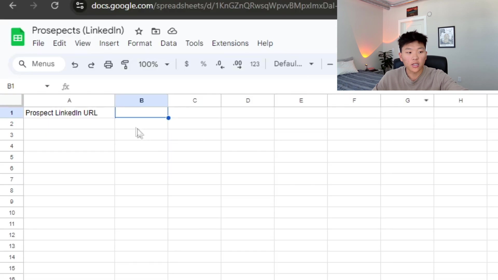 The image displays a Google Sheets spreadsheet with the title "Prosepects (LinkedIn)" open in a web browser. The spreadsheet has two columns visible: 'A' labeled "Prospect LinkedIn URL" and 'B' which is currently empty. The cell B1 is selected, indicated by a blue border. Above the spreadsheet, the Google Sheets menu bar is visible with options like File, Edit, View, Insert, Format, Data, Tools, and Extensions. A young man is visible in the top right corner of the screen, looking at the camera.