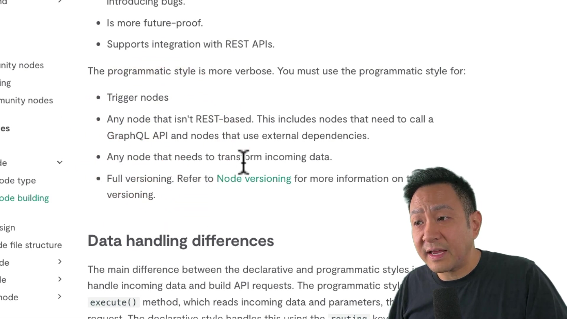 The image shows a man in the lower right corner of the frame, with a document visible in the background. The document lists the differences between declarative and programmatic node types. The text includes bullet points such as 'Introducing bugs,' 'Is more future-proof,' and 'Supports integration with REST APIs.' The programmatic style is described as more verbose and necessary for trigger nodes, non-REST-based APIs like GraphQL, nodes needing to transform incoming data, and full versioning.