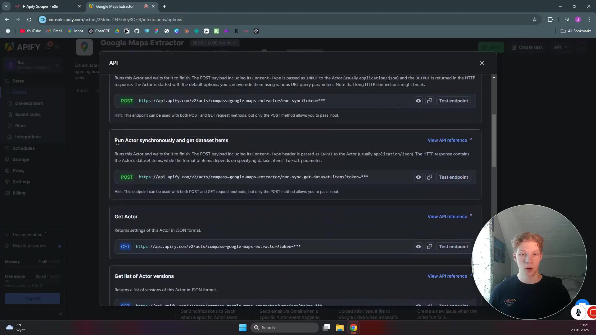 The image shows the Apify console interface, specifically the 'Google Maps Extractor' page under the 'Integrations' section. The main content area displays various API endpoints and their descriptions. Key sections include 'Run Actor and wait for it to finish' with a POST request URL, 'Run Actor asynchronously and get dataset items' also with a POST request URL, and 'Get Actor' with a GET request URL. Each section has a 'Test endpoint' button and a 'View API reference' link. The 'Run Actor asynchronously and get dataset items' section is highlighted as the relevant one for the demonstration. On the left, a sidebar shows navigation items like 'Dashboard', 'Development', 'Saved tasks', 'Runs', 'Integrations', 'Schedules', 'Storage', 'Settings', and 'Billing'. The male speaker is visible in the webcam overlay in the bottom right corner. The top browser tabs indicate 'Apify Scraper - n8n' and 'Google Maps Extractor'.