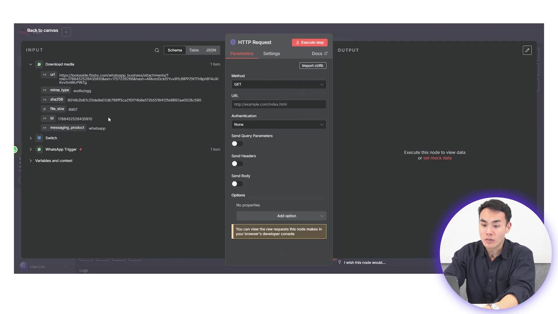 The image shows a software interface, likely n8n, displaying an 'HTTP Request' node configuration. The left panel, labeled 'INPUT', shows a JSON-like structure with details from a 'Download media' node, including 'url', 'mime_type', 'sha256', 'file_size', and 'id' for an audio file. The main panel shows the 'HTTP Request' node with tabs for 'Parameters', 'Settings', and 'Docs'. Under 'Parameters', the 'Method' is set to 'GET', and the 'URL' field contains 'http://example.com/index.html'. 'Authentication' is set to 'None'. Sections for 'Send Query Parameters', 'Send Headers', 'Send Body', and 'Options' are visible. At the bottom of the node, a message states: "You can view the raw requests this node makes in your developer console." A person is visible in the bottom right corner, looking at the screen and speaking.