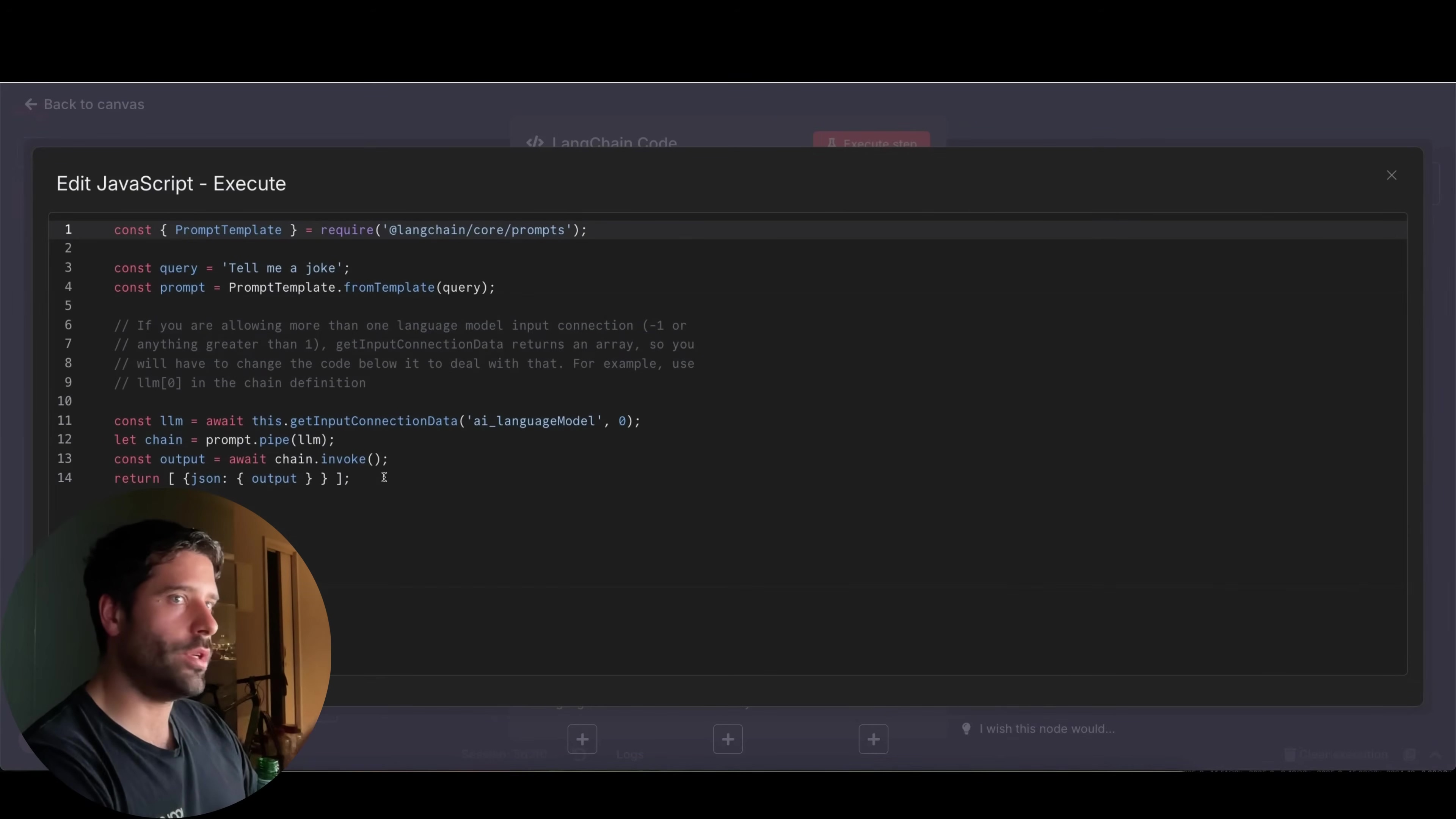 The image displays a code editor interface titled 'Edit JavaScript - Execute', showing JavaScript code related to a 'LangChain Code' node. The code defines a prompt template, a query, and then uses 'langchain/core/prompts' and 'ai_languageModel' to create and invoke a chain. Comments in the code explain how to handle multiple language model input connections. The code snippet includes 'const query = 'Tell me a joke';' and 'return { json: { output: llm } };'. A man with short dark hair and a beard is visible on the left side of the screen, looking towards the code editor. The top left corner has a 'Back to canvas' button.