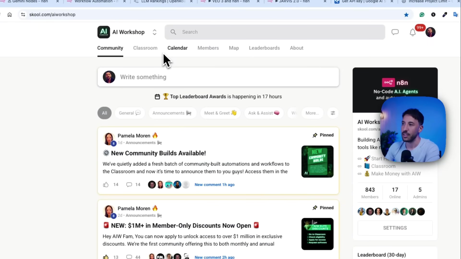 The image shows a web browser interface displaying a social media-like platform called "AI Workshop". The main content area shows a feed with posts, including one titled "New Community Builds Available!" and another "New: $1M+ in Member-Only Discounts Now Open". Navigation tabs at the top include "Community", "Classroom", "Calendar", "Members", "Map", "Leaderboards", and "About". A search bar is present at the top center. On the right side, there's a sidebar with information about "n8n No-Code A.I. Agents and AI Workflows" and a link to "skool.com/aiworkshop". The person from previous images is visible in the bottom right corner, looking at the screen. The background behind the person is a blue and purple gradient.