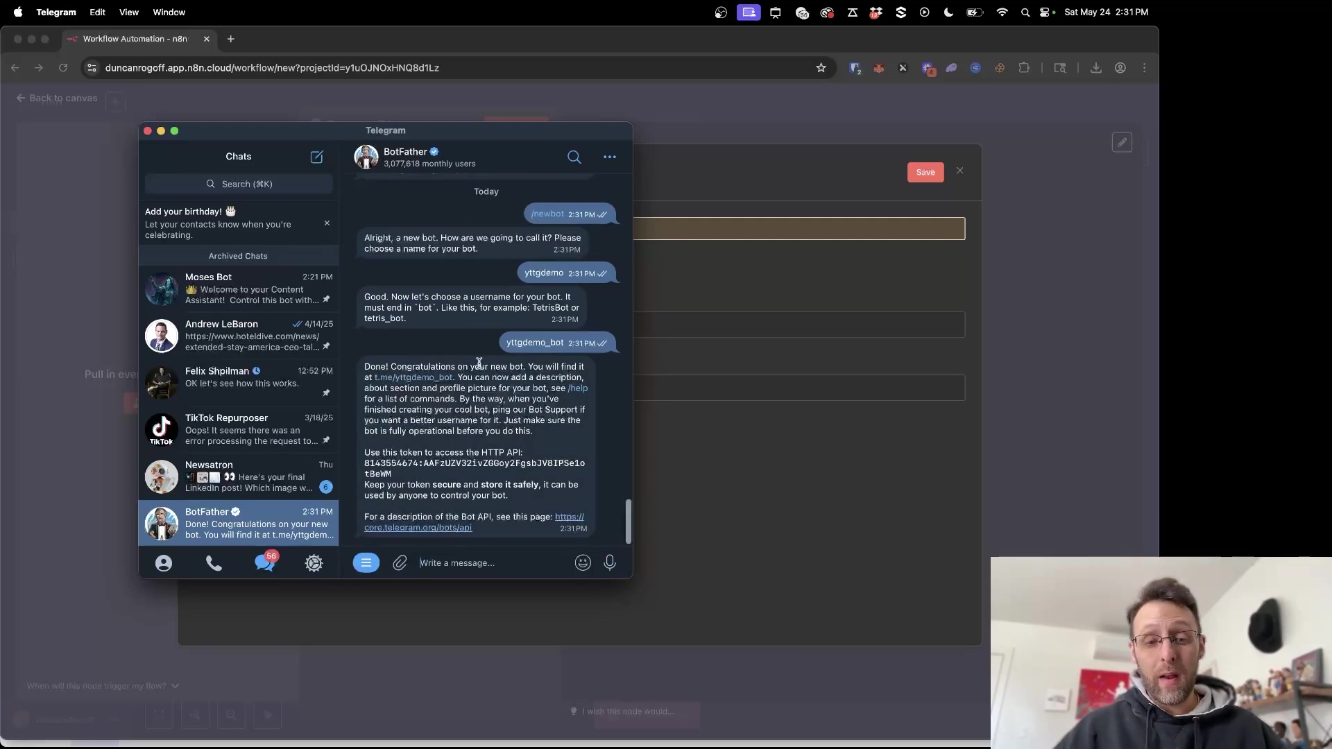 The image displays a Telegram chat window, specifically showing a conversation with 'BotFather'. The chat history includes messages from BotFather guiding the user through creating a new bot. Messages like 'Alright, a new bot. How are we going to call it? Please choose a name for your bot.' and 'Good. Now let's choose a username for your bot. It must end in bot.' are visible. The user's responses include 'YouTube tg demo' and 'YouTube tgdemo_bot'. The most recent message from BotFather, which is partially visible, congratulates the user on their new bot and provides an HTTP API token, stating 'Use this token to access the HTTP API: 812495541:AAH-uDZY1_128V2YF0g2a3W2FIPD5a1x8W'. The chat list on the left shows various contacts and groups, including 'Moses Bot', 'Andrew Lebaron', 'Felix Shoelman', 'TikTok InspoPurge', and 'Newsatron'. A man is visible in the bottom right corner, looking at the screen.
