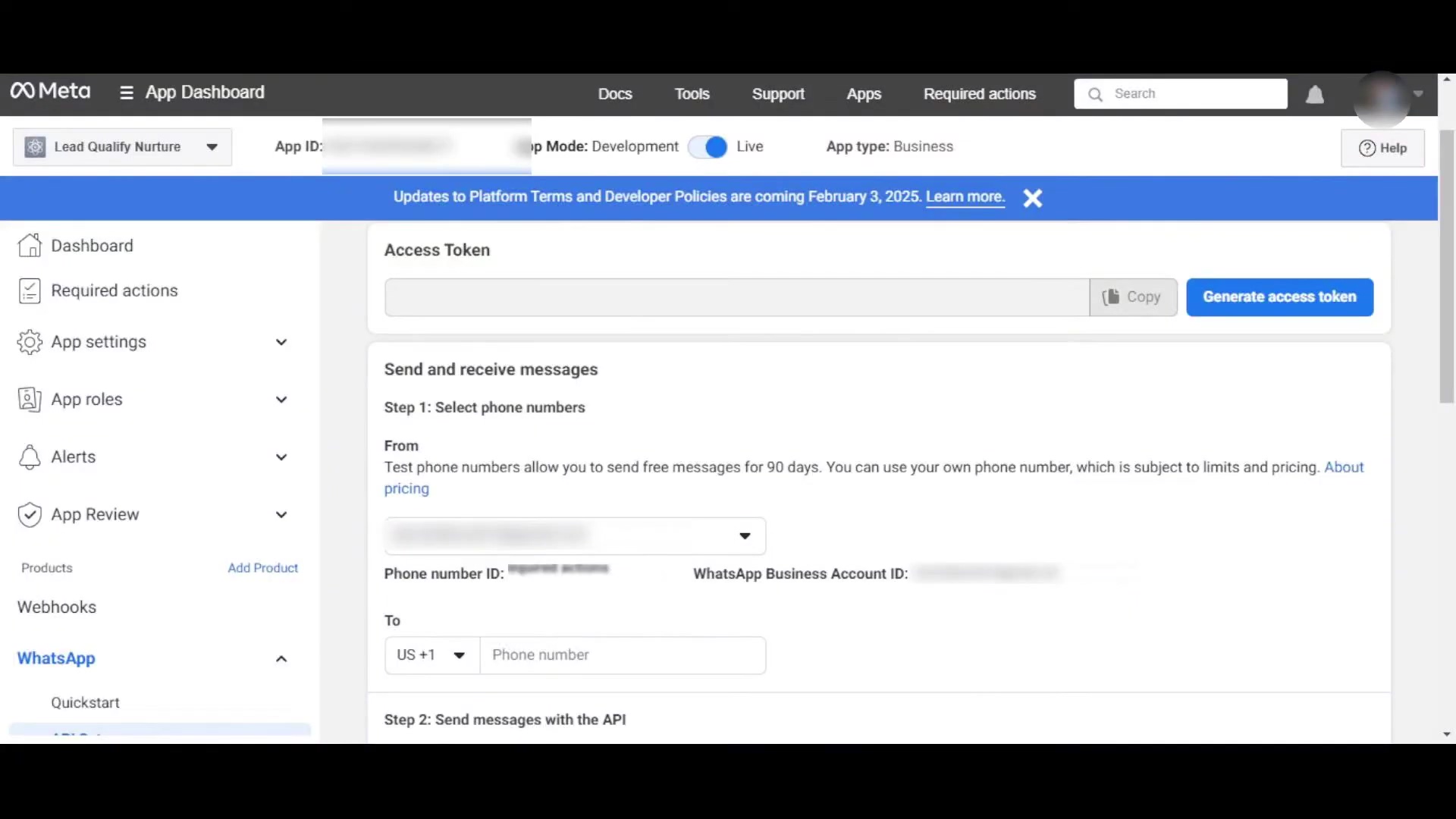 The image displays the Meta App Dashboard interface, showing the 'API Setup' section for WhatsApp. The central panel focuses on 'Send and receive messages'. 'Step 1: Select phone numbers' is visible, with a dropdown menu for selecting a phone number and fields for 'Phone number ID' and 'WhatsApp Business Account ID'. Below this, 'To' is displayed with a dropdown for country code, showing 'US +1', and an input field for 'Phone number'. The next section is 'Step 2: Send messages with the API'. The left sidebar shows navigation options including 'Dashboard', 'Required actions', 'App settings', 'App roles', 'Alerts', 'App Review', 'Products', 'Webhooks', and 'WhatsApp' with 'Quickstart' nested under it. A blue banner at the top indicates updates to Platform Terms and Developer Policies.