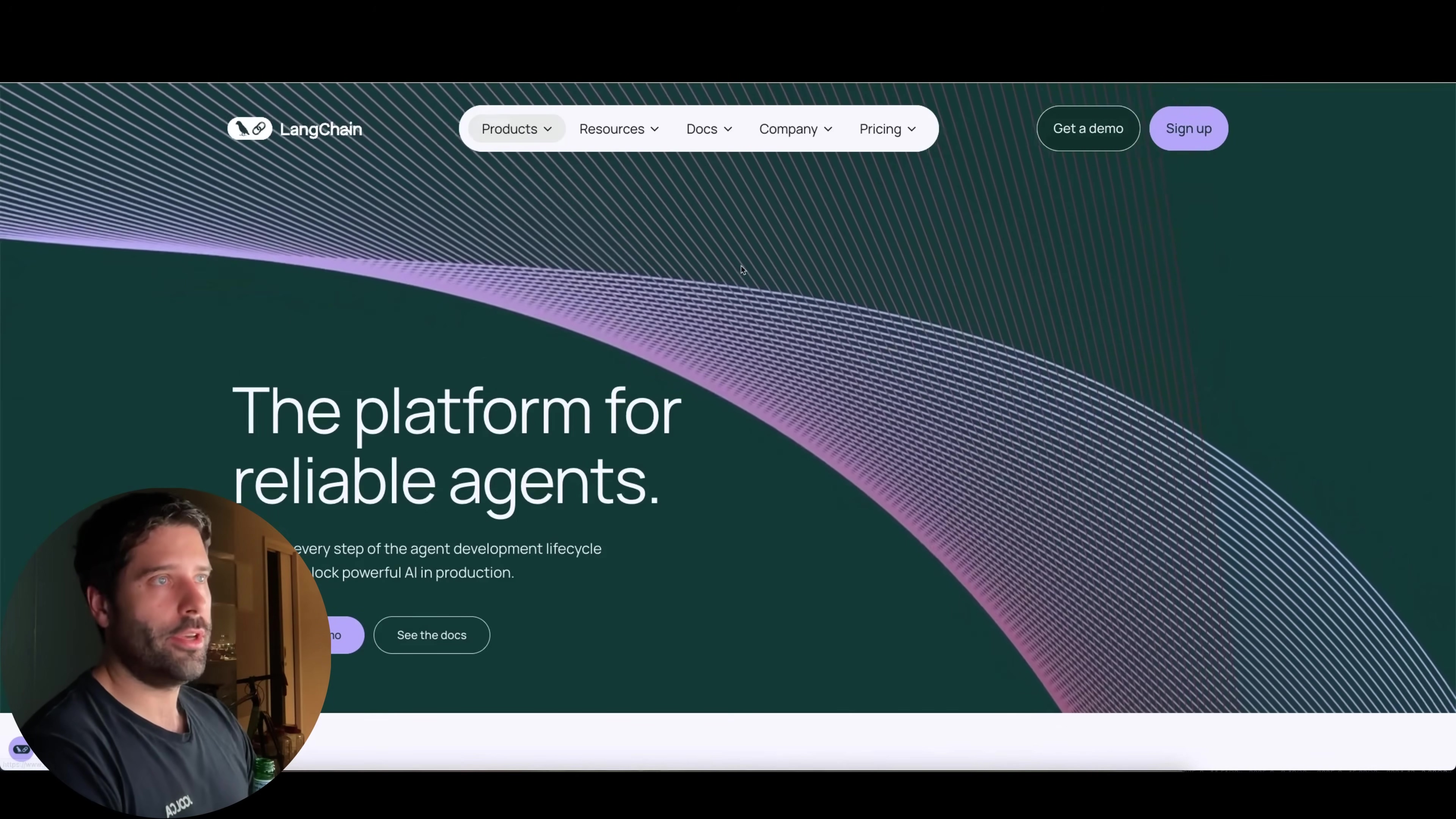 The image displays the LangChain website homepage, featuring a large headline 'The platform for reliable agents.' The website has a clean design with purple and white wavy lines in the background. The navigation bar at the top includes 'LangChain' logo, dropdowns for 'Products', 'Resources', 'Docs', 'Company', 'Pricing', and buttons 'Get a demo' and 'Sign up'. Below the main headline, there's smaller text about the agent development lifecycle and a 'See the docs' button. A man is visible in the bottom left corner, looking towards the screen.