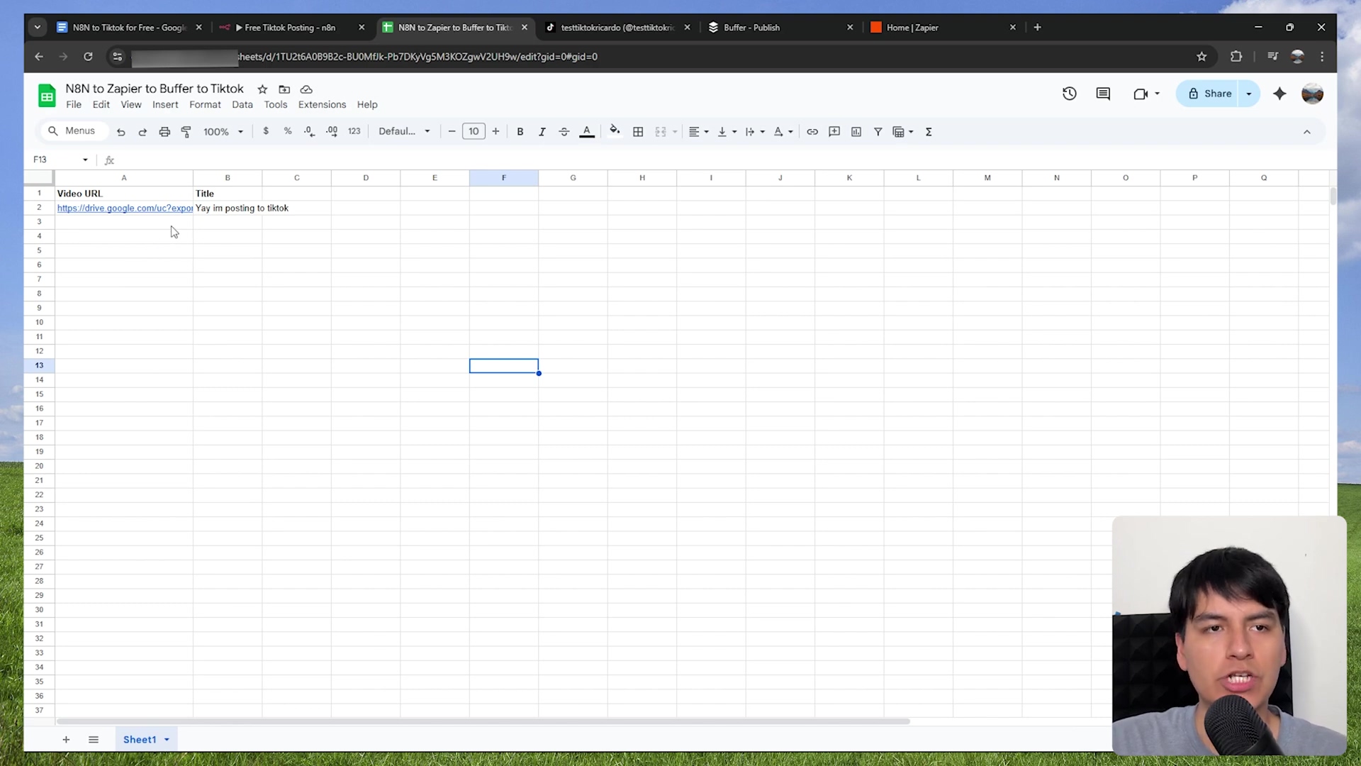 The image displays a Google Sheets spreadsheet within a web browser, likely Chrome, with multiple tabs open. The spreadsheet is titled 'N8N to Zapier to Buffer to TikTok' and contains two columns: 'Video URL' and 'Title'. The first row under the headers has a Google Drive URL in the 'Video URL' column and 'I'm posting to Tiktok' in the 'Title' column. A person is visible in the bottom right corner of the screen, looking towards the left. The browser tabs indicate various related services like 'N8N for Free', 'Free Tiktok Posting', 'N8N to Zapier to Buffer to TikTok', 'Buffer - Publish', and 'Home | Zapier'.