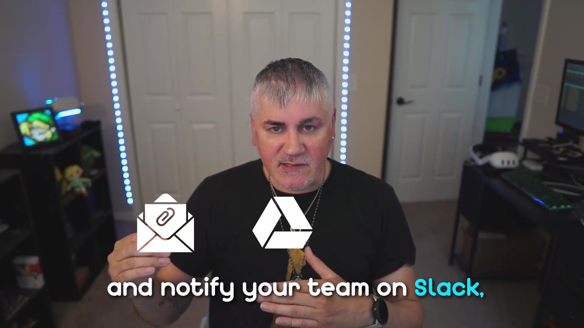The image features the same man from the previous frame, speaking to the camera. He is wearing a black t-shirt and a necklace. Two white icons are superimposed in front of him: an envelope icon with a paperclip on the left, and a Google Drive logo (a triangular shape with blue, green, and yellow segments) on the right. The background remains consistent with white double doors, a dark shelf unit with a blue-lit device and a green object on the left, and a partial view of a desk with a computer monitor on the right. Blue LED strip lights illuminate the walls. White text at the bottom of the screen reads "and notify your team on Slack,", with "Slack" highlighted in blue.