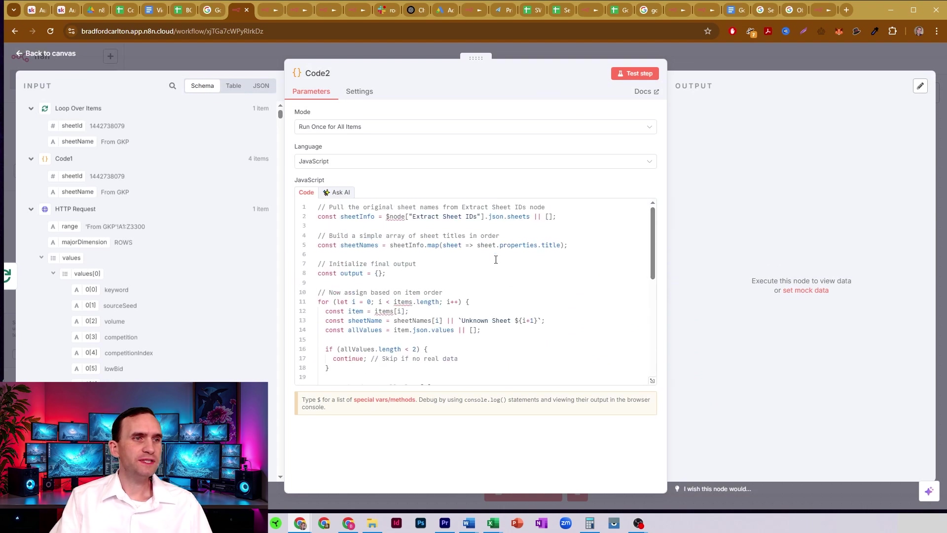The image displays a split screen with a man on the bottom left and an n8n workflow interface on the top right. The n8n interface shows a 'Code2' node with its 'Parameters' tab selected. The main panel displays JavaScript code, which appears to be processing sheet names and values. The code includes comments like 'Pull the original sheet names from Extract Sheet IDs node' and 'Build a simple array of sheet titles in order'. On the left side of the n8n interface, there's an 'INPUT' panel with 'Loop Over Items' and 'values' sections, showing various data fields like 'sheetId', 'sheetName', 'keyword', 'sourceSeed', 'volume', 'competition', and 'lowbid'. The man in the bottom left is wearing a blue shirt and is looking towards the right, with multiple computer monitors behind him.