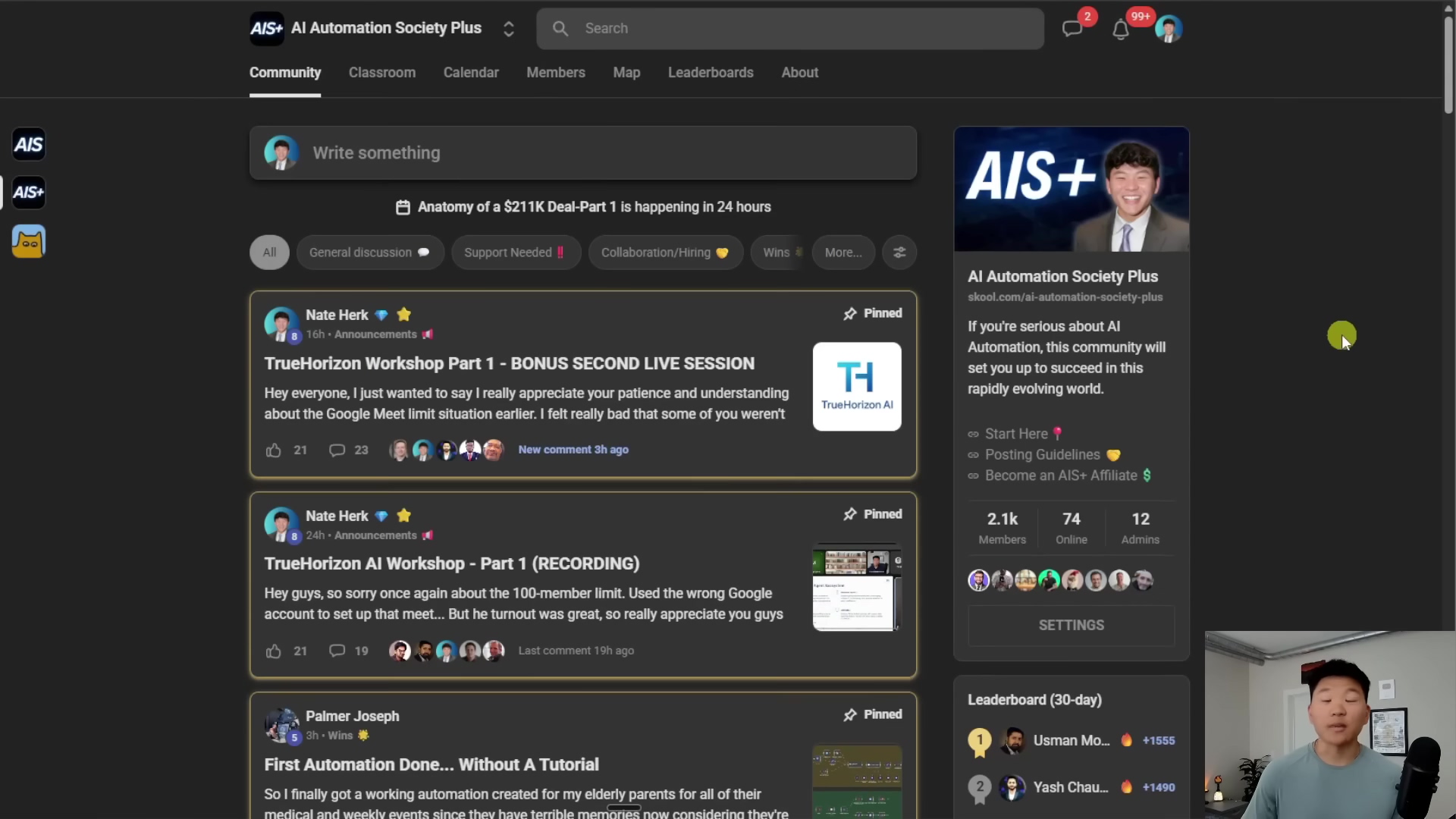 The image displays a dark-themed user interface of a platform called "AI Automation Society Plus". The main section shows a feed with posts, including two pinned posts by "Nate Herk" related to "TrueHorizon Workshop Part 1". The right sidebar features a prominent banner for "AI Automation Society Plus" with a smiling man's photo, a description of the community, and membership statistics (2.1k Members, 74 Online, 12 Admins). Below this, there's a "SETTINGS" button and a "Leaderboard (30-day)" section showing top users like "Usman Mo..." and "Yash Chau...". The top navigation bar includes options like "Community", "Classroom", "Calendar", "Members", "Map", "Leaderboards", and "About", along with a search bar and notification icons. A person is visible in the bottom right corner of the screen, partially obscured by the interface.
