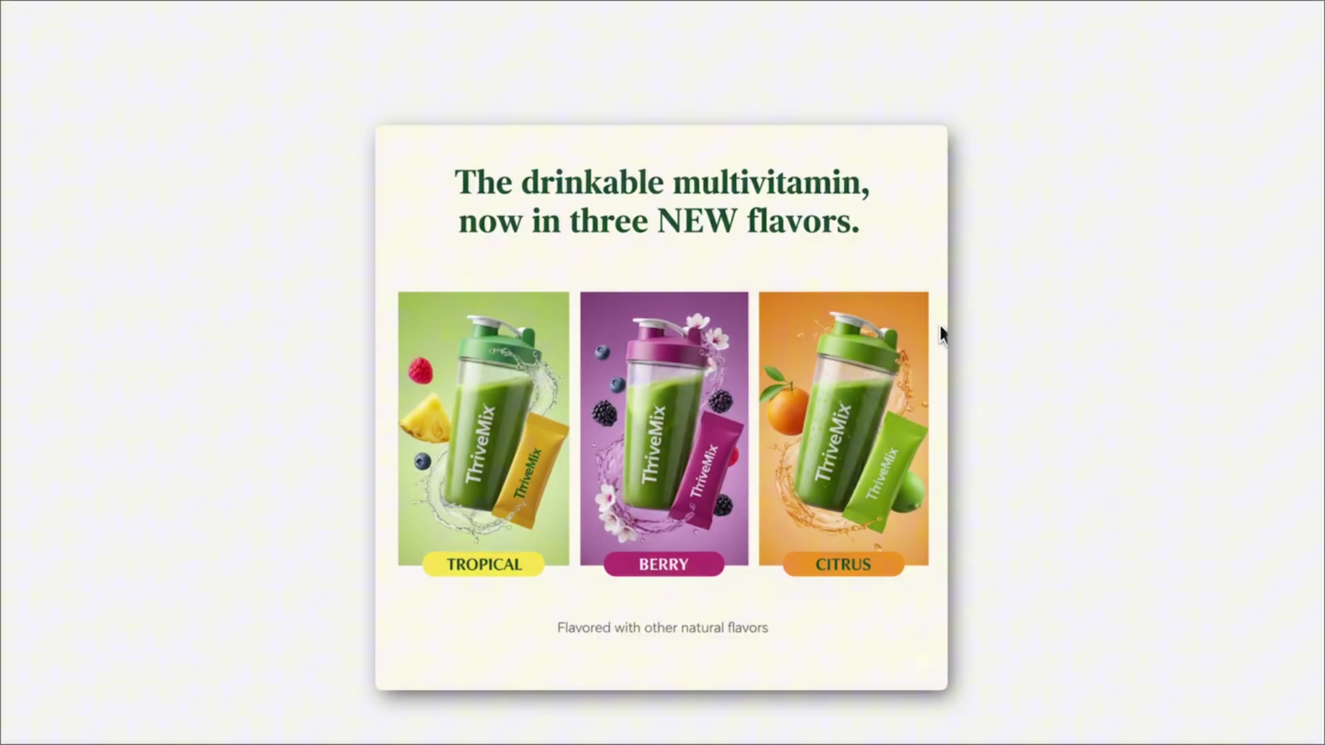 The image displays a simulated advertisement for 'ThriveMix', a drinkable multivitamin. The ad features three distinct product variations, each represented by a shaker bottle containing a green liquid, accompanied by a small packet of the product and relevant fruit garnishes. The background for each product is color-coded: green for 'Tropical' (with pineapple and mango), purple for 'Berry' (with blackberries and raspberries), and orange for 'Citrus' (with oranges and limes). The text at the top reads 'The drinkable multivitamin, now in three NEW flavors.' Below the product images, the flavors are labeled 'TROPICAL', 'BERRY', and 'CITRUS' with corresponding colored backgrounds. A smaller line of text at the bottom says 'Flavored with other natural flavors'. The overall composition is clean and product-focused, set against a light gray background, suggesting a digital ad creative.